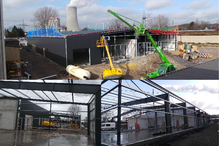 Baustelle der Gewerbehalle mit Stahlkonstruktion und Kran